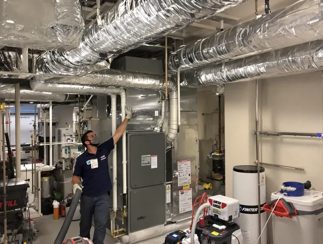 Northbridge Air Duct Cleaning specialist performing thorough furnace duct cleaning in a Northbridge residence