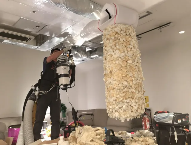 Northbridge Air Duct Cleaning technician performing precision vacuum insulation removal in a residential property in Northbridge