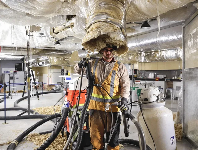 Professional vacuum insulation removal by Northbridge Air Duct Cleaning expert in Northbridge